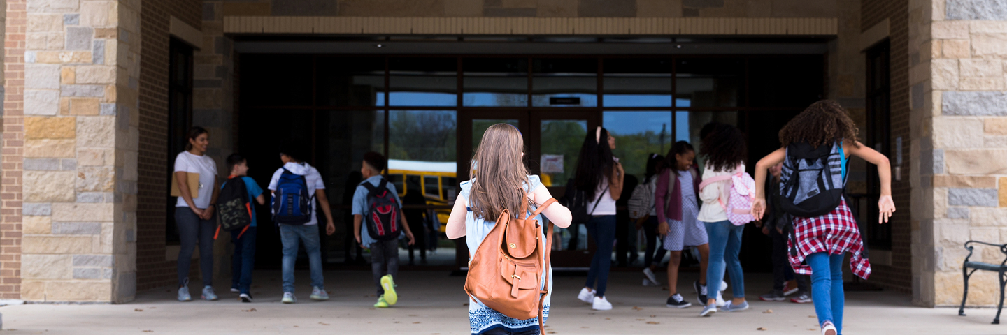 Group of Kids Entering School Building